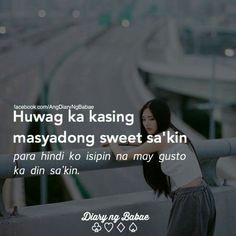 a woman standing on top of a bridge next to a train track with the caption saying,'huwag ka kissing masayong sweet sa skin