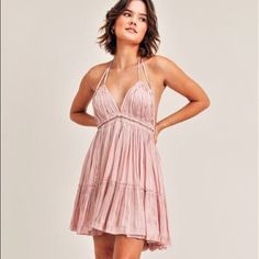 Beautiful Pink Dress With Flowing Layers And Halter Tie Neckline. Sexy Open Back With A Cinch Tie. Feminine Backless Mini Dress For Brunch, Flirty Backless Mini Dress For Spring, Flirty Backless Spring Mini Dress, Spring Ruched Backless Mini Dress, Flirty Ruched Backless Dress For Spring, Feminine Mini-length Backless Dress For Date Night, Feminine Spring Backless Mini Dress, Feminine Mini Length Backless Dress For Date Night, Flirty Halter Dress For Brunch