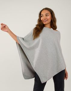 Dodge the cool evening breeze in this plain poncho, available in a range of colours to suit every style. Cosy yet lightweight, it's the perfect layer for any season. Grey Pink Blanket Scarf, Blanket Scarves, Grey Poncho, Knit Poncho, Grey Scarf, Cardigan Shirt, Poncho Cape, Knitted Poncho, Loungewear Sets