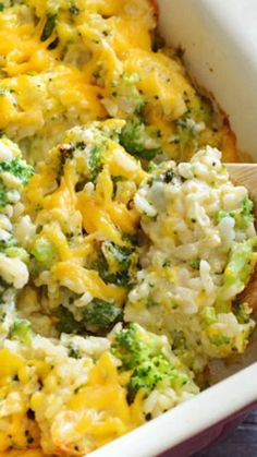 a casserole dish with broccoli, cheese and other vegetables in it