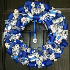 a baseball wreath is hanging on the front door