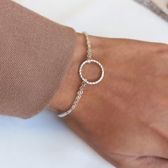 Minimalist hammered open circle Karma ring bracelet. Perfect minimal friendship bracelet gift for women. ▸▸ Materials ◂◂ - Silver: all components are sterling silver 925. - Gold: charm is a high-quality 18k gold coating over sterling silver.  Chain, findings and spring clasp are all 14k gold filled. - Rose Gold: charm is high-quality rose gold coating over sterling silver.  Chain, findings and spring clasp are all 14k rose gold filled. ▸▸Ring size▸▸ 14mm ▸▸ Bracelet Length ◂◂ 6.5" + 1" extending chain  Leave a note at checkout if you want a different length. ▸▸ Finish: Hammered & Shiny ◂◂ - Karma necklace set: https://www.etsy.com/listing/490830385 ▸ All jewelry comes in a nice package and ready to give as a gift. ▸Shop Policies: http://etsy.me/2nEdvsh BR49 - "Karma Bracelet" Minimalist Round Hammered Bracelet, Minimalist Round Bracelets For Friendship, Dainty Hammered Adjustable Bracelets, Nickel Free Circular Bracelets For Gift, Dainty Adjustable Circle Bracelets, Adjustable Dainty Circle Bracelets, Adjustable Circle Chain Bracelet For Gift, 14k Rose Gold Filled Ring, Karma Ring