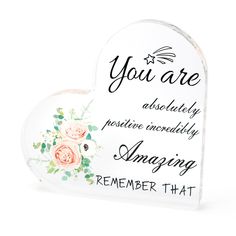 a heart shaped sign with flowers on it that says, you are absolutely creatively amazing