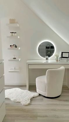 a white desk and chair in a room with a round mirror on the wall above it