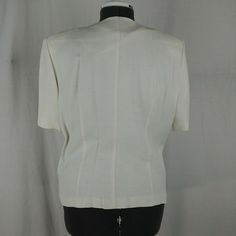 "Bust: 22\" Shoulder: 17.5\" Blouse Length: 22.5\" Waist: 15.5\" Inseam: 29\" Pants Length: 42.5\" All measurements are taken straight across, chest and waist are not doubled. Length is measured from the back of the neck to the hem. Suit set is in good preowned condition, no major stains (light makeup stain on chest), odors or tears ( small snag on left knee). May have minor imperfections - see pictures for details." Classic Formal Tops With Notch Lapel, Tailored Short Sleeve Formal Tops, Formal Tailored Blouse With Pockets, Classic Fitted Blouse With Pockets, Formal Fitted Blouse With Pockets, Fitted Formal Blouse With Pockets, Formal Tailored Top With Pockets, Tailored Formal Top With Pockets, Tailored Short Sleeve Tops For Office