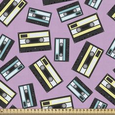 a purple background with yellow and black cassette tape recorders on top of each other