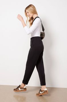 The ultimate wardrobe essential, these comfy Varley pants are crafted in their signature DoubleSoft™️ knit fabric and feature a tapered leg with cuffed hems, side pockets, and a pull-on elastic waist. Tuck in a tee or pair with a pullover for the perfect casual-cool look. | VARLEY Women's The Turn Up Cuff Pants 26', Size XS, Black Workwear Sweatpants With Side Pockets, Casual Joggers With Elastic Cuffs For Work, Classic Straight Hem Sweatpants For Work, Relaxed Fit Joggers With Side Pockets For Work, Chic Bottoms With Ribbed Cuffs For Fall, Workwear Pants With Elastic Waistband And Cuffed Ankles, Straight Leg Joggers With Pockets For Workwear, Classic Tapered Leg Sweatpants For Workwear, Relaxed Fit Joggers For Fall Workwear