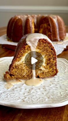 a bundt cake with icing on a white plate