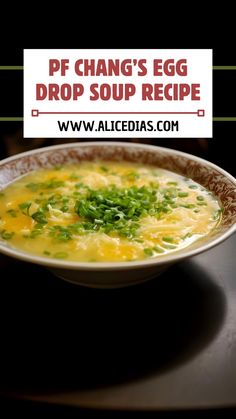 a bowl filled with soup sitting on top of a table next to a sign that reads p f change's egg drop soup recipe