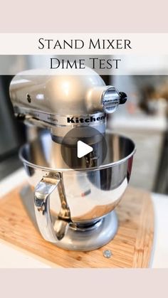 a stand mixer sitting on top of a wooden cutting board with the words stand mixer dime test