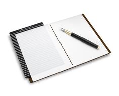 a notepad with a pen on top of it