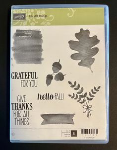 a clear plastic case with some stamps and inks on it that says grateful for you