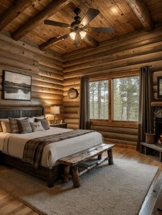 a large bed sitting in a bedroom next to a wooden wall mounted fireplace and ceiling fan