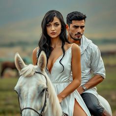 a man and woman riding on the back of a white horse next to each other