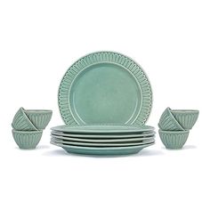 a set of green dishes and cups on a white background