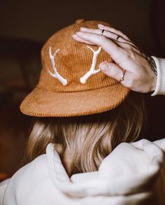 The Classic Antler Cap is a 6 panel, made from 100% organic corduroy cotton. Featuring our classic embroidered antlers to the front and Harrison & Wild Co. text embroidered to the reverse. Finished off with our antler embossed metal clasp, to fully adjust to most head sizes. FEATURES . 100% organic corduroy . Classic 6 panel style . Metal embossed buckle . Adjustable strap fits most. CARE INSTRUCTIONS . Wash cycle 30o or under   (hand wash preferred) . Hang dry to keep shape or tumble dry low . Wash with similar colours . Do not iron over embroidery Actual product color may vary from the images shown. Winter Cotton Snapback Hat With Curved Brim, Winter Cotton Snapback Hat With Flat Brim, Cotton 5-panel Winter Hats, Winter Corduroy Baseball Cap With Curved Brim, Winter Cotton Baseball Cap With Flat Brim, Winter Snapback Hat, Winter Corduroy Hat With Curved Brim, Winter Corduroy Adjustable Hat, Corduroy Winter Cap