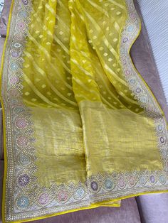 organza weaving with dori work  Prebooking Yellow Organza Blouse Piece With Cutdana, Traditional Gold Organza Sharara, Transitional Season Unstitched Organza Saree, Transitional Gold Organza Traditional Wear, Yellow Organza Sharara With Pallu, Transitional Organza Saree With Zari Work, Transitional Season Wedding Unstitched Tissue Silk Suit, Transitional Wedding Tissue Silk Unstitched Suit, Traditional Unstitched Organza Suit For Wedding