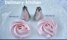 two pairs of pink shoes on a white plate with a rose in the middle and an additional pair for each shoe