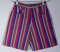 We ADORE these colorful, bright and bold print striped shorts! Here's a pair of striking, made in USA 80s collectible "Enchant" label jean shorts with a cute, fun style. The denim cotton print of stripes in vibrant colors are stunning with a great bare back pattern to the cut. These gem shorts are a rare find and definitely standout in a crowd. These cotton denim shorts really have that classic 80s look and cut and they are in really great overall condition with more minor signs of wear or use. Retro High Waist Multicolor Shorts, Retro Striped Short Bottoms, Retro Striped Short-length Bottoms, Vintage Multicolor Short Length Bottoms, Vintage Multicolor Short Bottoms, Spring Multicolor Striped Bottoms, Multicolor Bermuda Bottoms For Spring, Multicolor Vertical Stripes Bottoms For Spring, Retro Bermuda Shorts For Summer