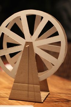 a paper model of a spinning wheel on a table