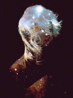 a woman's head with stars in the background