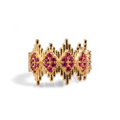 Ruby Stone & Gold Crown Adjustable Statement Ring, a luxurious and elegant piece designed to add a touch of royalty to your style. Crafted from 24k gold-plated brass, this stunning ring features geometric crown-like lines adorned with delicate ruby stones, creating a refined yet striking effect. The intricate design captures a regal aesthetic, making it both a sophisticated and eye-catching accessory. With its adjustable band, this ring offers versatility and comfort, making it perfect for any occasion Details Crafted with high-quality brass and plated with 24k gold for a luxurious finish. Ruby stone Adjustable size Avoid contact with chemicals, makeup, perfume. Do not use dips or abrasive cleaners on ring. To clean and brighten it up your ring, wipe them gently with jewelry polishing clot Luxury Gold Jewelry With Decorative Band, Gold Ruby Ring With 17 Jewels For Wedding, Regal Gold Jewelry For Formal Occasion, Adjustable Yellow Gold Ruby Jewelry, Adjustable Elegant Ring For Festive Occasions, Elegant Adjustable Rings For Festive Occasions, Opulent Gold-plated Gold Jewelry, Luxury Gold Ruby Birthstone Ring, Opulent Gold-plated Jewelry