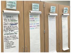 three bulletin boards with writing on them next to each other