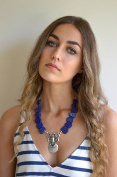 This handmade choker necklace is a beautiful combination of Lapis Lazuli big stones and beautiful Antique Silver plated pendant, that create an exotic color combination. This is a fashionable, one of a kind necklace. It is super cool, with such a great bohemian look. please check my website. See my unique collection: www.ninnos.etsy.com www.ninonarimanidze.com Blue Gemstone Accents Necklace, Blue Lapis Lazuli Jewelry For Festivals, Bohemian Blue Jewelry With Gemstone Accents, Bohemian Jewelry With Natural Lapis Lazuli Stones, Bohemian Lapis Lazuli Jewelry With Gemstone Beads, Handmade Lapis Lazuli Jewelry For Festivals, Bohemian Gemstone Choker Necklace, Blue Bohemian Choker Jewelry, Bohemian Lapis Lazuli Gemstone Jewelry