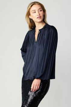 Delicate pleats enhance the billowy shape if this long-sleeve blouse. Featuring a split neckline with ruffle trim and tie detailing, it's loose, floaty, and incredibly romantic. •Split neckline with self-tie •Ruffle trim •Pleat detailing •Long sleeves with elasticized cuffs •Relaxed fit item number 2330055 100% Polyester Hand wash cold