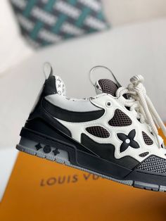 Embrace a bold and sophisticated aesthetic with these Louis Vuitton LV Skate-inspired sneakers in a timeless black and white colorway. Crafted with meticulous attention to detail, these shoes feature a unique blend of materials, including breathable mesh and luxurious leather, for a sporty and refined look. The signature Louis Vuitton monogram subtly adorns the design, adding a touch of understated luxury. Whether you're hitting the streets or the skate park, these sneakers will elevate your sty Fall Winter Jacket, Sophisticated Aesthetic, Understated Luxury, Loafer Sneakers, Bottega Veneta Shoulder Bag, Skate Park, Shoe Box, The Streets, White Sneaker