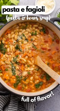 pasta e fagioi with beans and spinach in a white pot on a table