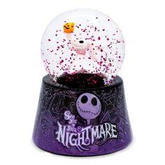 a snow globe with an image of jack and sally from the animated movie, nightmare