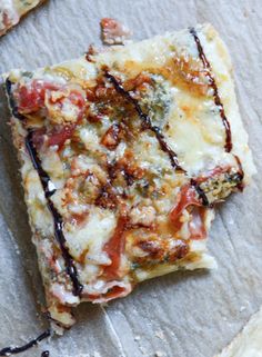 a piece of pizza sitting on top of a table