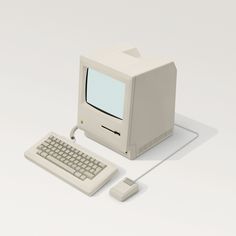 an old computer sitting on top of a white table next to a keyboard and mouse