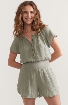 Gauzy, lightweight double-cloth cotton lends breezy style to this short-sleeve romper shaped by smocking at the waist. Button half placket Band collar Short sleeves Front slant pockets Smocked waist 100% cotton Hand wash, dry flat Imported Summer Short Sleeve Jumpsuits And Rompers With Button Closure, Summer Daywear Jumpsuits And Rompers With Short Sleeves, Summer Short Sleeve Jumpsuits And Rompers For Daywear, Summer Daywear Short Sleeve Jumpsuits And Rompers, Cotton Short Sleeve Jumpsuits And Rompers For Beach, Short Sleeve Cotton Jumpsuits And Rompers For The Beach, Summer Jumpsuits And Rompers With Short Sleeves Relaxed Fit, Casual Short Sleeve Jumpsuits And Rompers For Beach, Casual Short Sleeve Jumpsuits And Rompers For Vacation