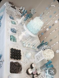 a table topped with lots of desserts and cupcakes