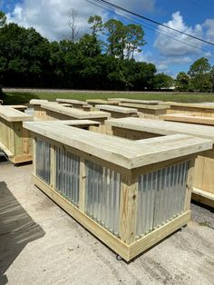 several wooden boxes are lined up on the ground