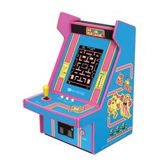 an old school arcade machine that is pink and blue with the game on it's side