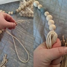 two hands holding rope and beads on top of a table