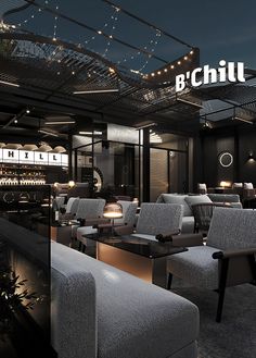 the interior of a restaurant with chairs and tables in front of an illuminated sign that reads b'chill