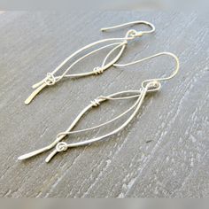 These long silver dangle earrings are all handmade using quality materials and should bring you years of enjoyment. You'll love the unique look of the Sterling hammered wires and the handmade ear wires that are extra long for your comfort. The 3” silver dangle earrings are lightweight yet sturdy. Treasure Hoard, Earrings Long Silver, Long Silver Earrings, Dangle Earrings Silver, Wrapped Earrings, Earrings Bridesmaid, Rustic Jewelry, Silver Dangle Earrings, Funky Jewelry