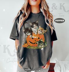 Vintage 90s Cat Halloween Shirt ⭐ Welcome to K & K Custom Tees! ⭐  - Indulge in pure comfort with our Comfort Colors Shirt. Soft, relaxed, and available in a variety of colors! ⭐SHIRT DETAILS⭐  -High Quality fabric  -100% ring-spun US cotton -Designed and printed in the USA  ⭐ PLEASE NOTE ⭐ -For an oversized look, we suggest to size up 1-2 sizes. These shirts run like standard unisex tees. Please see size chart for a more fitted look!  -Colors may vary based on your monitor or screen display! ⭐C Fall Cat Print Streetwear Top, Y2k Short Sleeve Halloween T-shirt, Y2k Style Halloween Short Sleeve T-shirt, Y2k Crew Neck T-shirt For Halloween, Spooky Fall Tops With Cat Print, Spooky Cat Print Tops For Fall, Keyword Research, Cat Halloween, Pumpkin Shirt