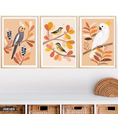 three birds are sitting on the branches in front of a wall with baskets and baskets