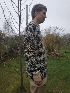 "Vintage men's knit wool sweater. Ivory black snowflake patterned knitted pullover. L size 95% wool 5% elastan From shoulder to shoulder 24\" 61cm Chest 44\" 112cm Sleeve length 29,5\" 75cm Length 31\" 79cm In good vintage condition" Black Wool Sweater With Fair Isle Pattern, Nordic Jacquard Knit Winter Sweater, Cream Wool Sweater With Fair Isle Pattern, Nordic Style Long Sleeve Sweater With Fair Isle Pattern, Cream Jacquard Knit Winter Sweater, Cream Jacquard Knit Sweater For Winter, Scandinavian Style Long Sleeve Sweater With Fair Isle Pattern, White Scandinavian Style Long Sleeve Sweater, Long Sleeve Fair Isle Sweater For Cold Weather