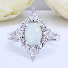 Metal Type: Sterling Silver Metal Stamp: 925 Gemstone Type: Lab White Opal, AAA Cubic Zirconia Gemstone Shape: Oval Halo Gemstone Creation Method: Simulated Ring Measurements: 14mm x 16mm Available in different metal colors and stone colors as well. Please message me for inquiry!