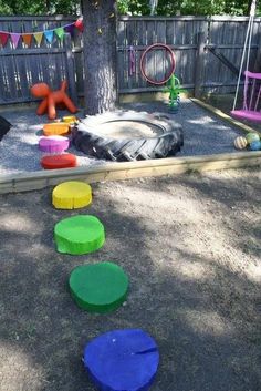 children's play area with colorful plastic discs on the ground