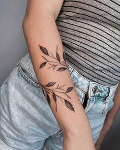 a woman with a tattoo on her arm