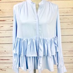 This Is A Beautiful Ruffle Blouse By Dr2 By Daniel Rainn In French Blue. It Has Flowy Ruffles At The Bottom And Buttons Down The Front. Size M All Items Come From A Smoke Free Home. Due To Variations In Cameras, Lighting, And Environment, Colors May Vary Slightly From The Photos. Please Review All Pictures And Feel Free To Ask Any Questions. Feminine Light Blue Blouse For Spring, Blue Ruffled Blouse For Daywear, Spring Light Blue Ruffled Blouse, Light Blue Feminine Blouse With Ruffles, Light Blue Ruffled Blouse For Spring, Feminine Light Blue Blouse With Ruffles, Chic Light Blue Tops For Layering, Summer Blue Viscose Blouse, Blue Viscose Summer Blouse