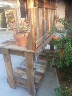 a potted plant sitting on top of a wooden stand