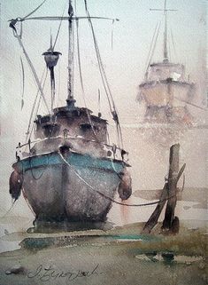 two boats sitting in the water on a foggy day